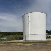Pressure Wash Tank and added Rock around the Pad